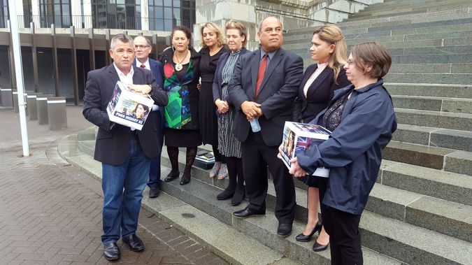 Family First national director Bob McCroskie (left) presents a porn inquiry petition to MPs Chester Borrows, Louisa Wall, Marama Fox, Jan Logie, Aupito William Sio and Ria Bond. Photo / Felix Marwick