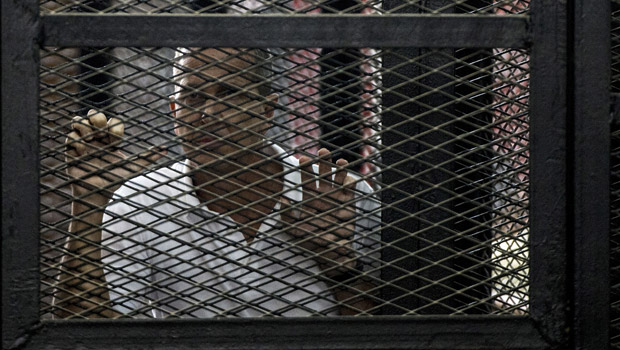 Rallies have been held in London and The Hague in support of three Al-Jazeera journalists marking a year in prison in Egypt (Getty Images)