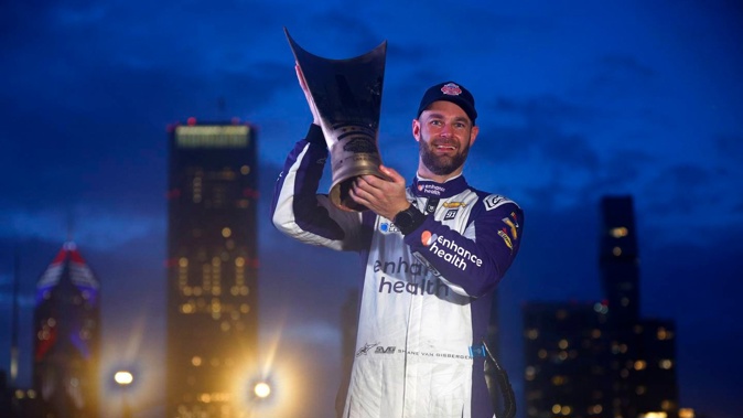 Shane van Gisbergen celebrates with the trophy after his Nascar win. Photo / Getty