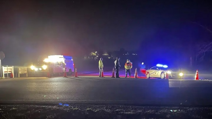 Emergency responders are seen near a site where two military helicopters crashed during a routine training mission in Trigg County, in southwestern Kentucky. Photo / AP