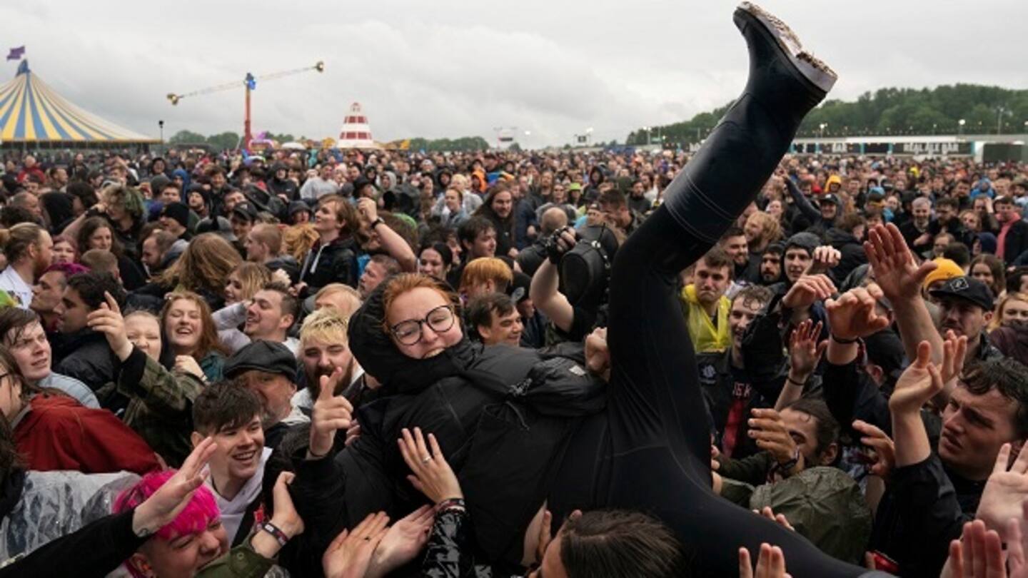 A festivalgoer crowd surfs on the first day of Download Festival. Photo / AP