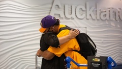 Joshua Gray hugs mum Clara after arriving from Dubai. They were among families reunited as the first international flight not subject to MIQ rules arrived at Auckland in March. Photo / Sylvie Whinray