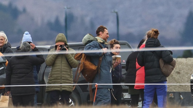 Hollywood actor Tom Hiddleston (centre carrying brown bag) is pictured at the staging area below The Remarkables for an upcoming film where he plays Sir Edmund Hillary.