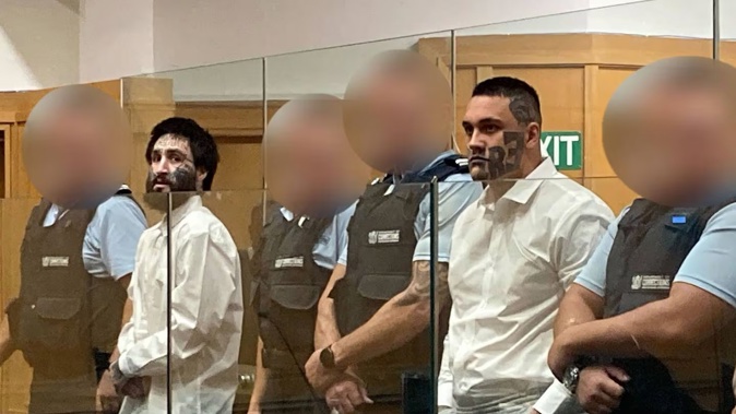 Mongrel Mob Aotearoa member Quadye Hulbert, left, and prospect Billy Rielly in the dock of the High Court at Hamilton. The pair are defending a murder charge over the death of Eli Johnson on June 12, 2022, in the Bay of Plenty. Photo / Belinda Feek