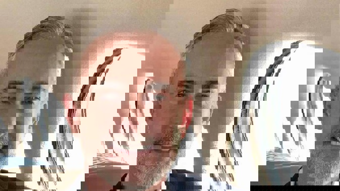 Those allegedly behind an elaborate Tinder scam used this photo of Mark Cain to create an identity for a Dale Plumides.