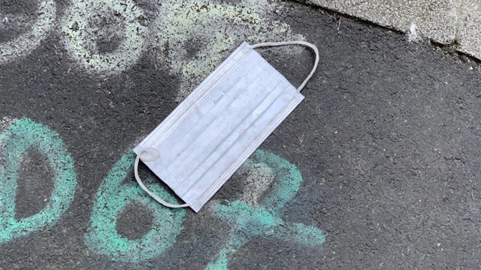 A discarded mask left on an Auckland street. Photo / Supplied