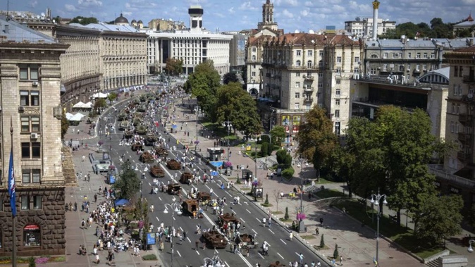 People look at a large column of burnt out and captured Russian tanks and infantry carriers which have been on display on the central Khreshchatyk boulevard. Photo / AP
