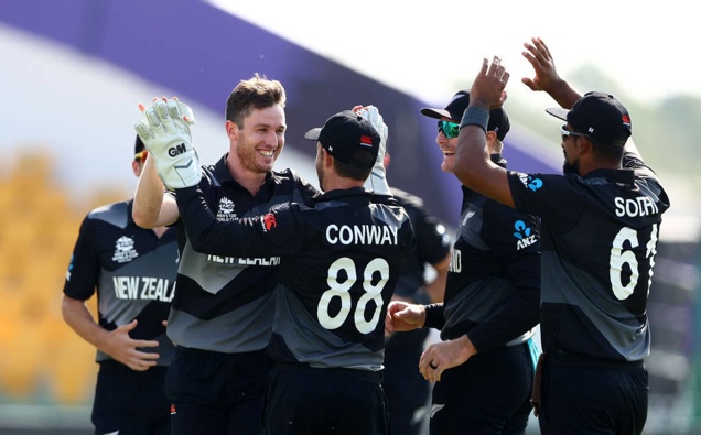 Adam Milne of New Zealand celebrates the wicket of Mohammad Shahzad of Afghanistan with teammates. (Photo / Getty)