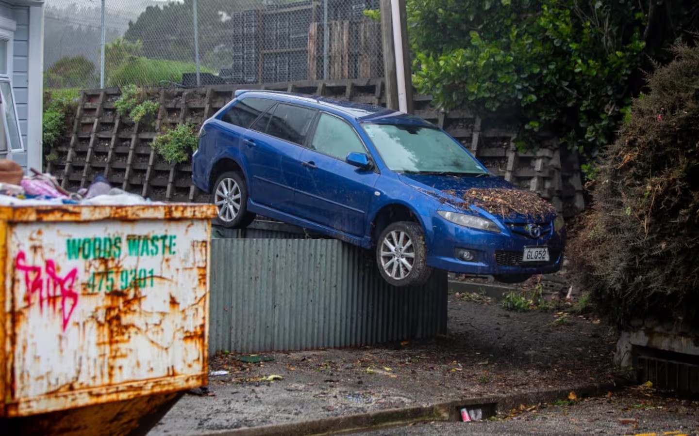 Wellington man 'dumbstruck' to find car on fence after flood