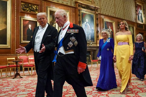 US President Donald Trump, King Charles III, Queen Camilla and First Lady Melania Trump make their way to the State Banquet at Windsor Castle. Photo / Getty Images