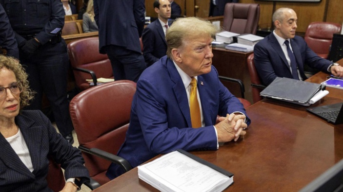 Former President Donald Trump, center, sits at the defense table with his attorneys Susan Necheles, left, and Emil Bove in Manhattan criminal court, Tuesday, May 7, 2024, in New York. (Sarah Yenesel/Pool Photo via AP)