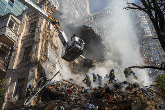 Firefighters work after a drone attack on buildings in Kyiv, Ukraine. Photo / AP