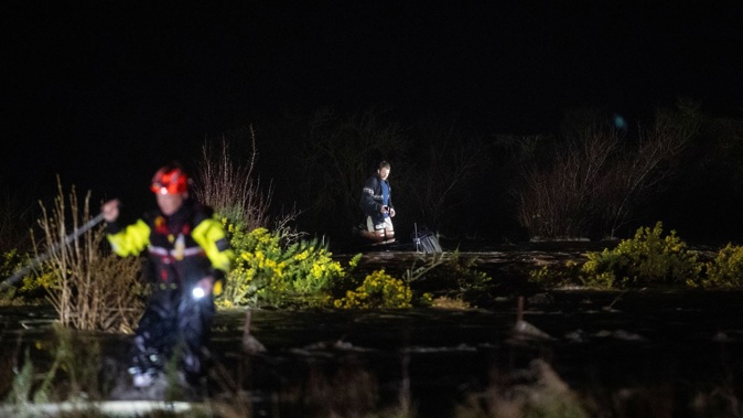 A man was rescued from his car roof after being swept away crossing a flooded river on McLaughlins Rd in Darfield, Canterbury. Photo / George Heard