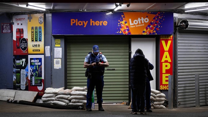 Police attended Smart Superette on Mount Smart Rd in Onehunga following a robbery around 8.45pm last night. Photo / Hayden Woodward