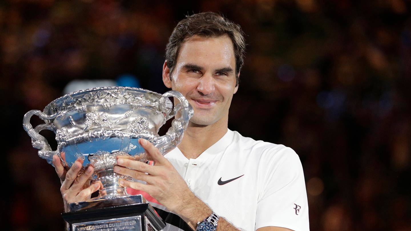 Roger Federer pictured holding the trophy for the last of his 20 grand slams - the 2018 Australian Open. The tennis legend has today announced his retirement from the sport. Photo / AP