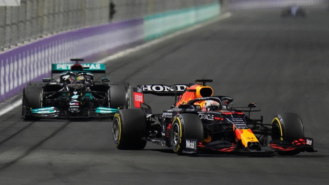 Red Bull driver Max Verstappen of the Netherlands, front, and Mercedes driver Lewis Hamilton of Britain in action t during the Formula One Saudi Arabian Grand Prix. Photo / AP