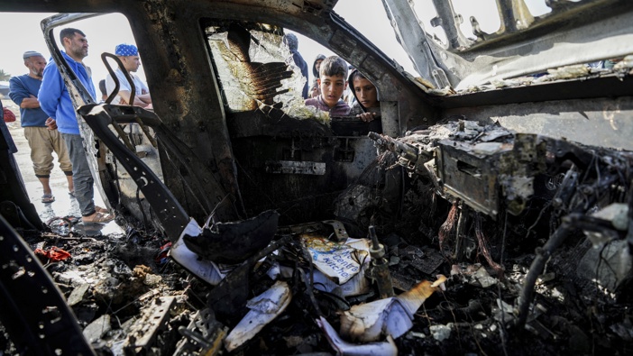 People inspect the site where World Central Kitchen workers were killed in Deir al-Balah, Gaza Strip, Tuesday, April 2, 2024. Photo / AP