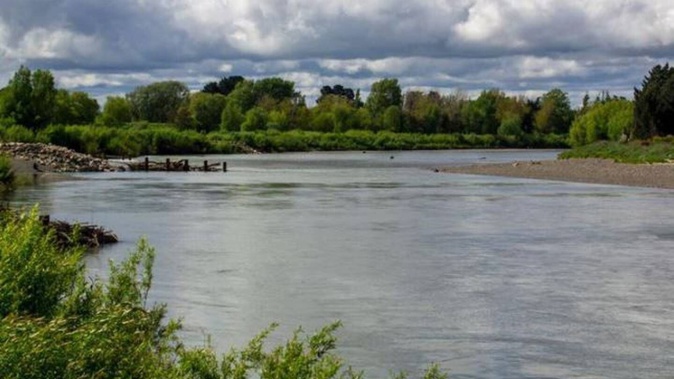 Emergency services are searching for a man missing after getting into trouble in the Manawatū River. Photo / 123RF