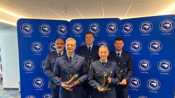 Patrick Noiseux (front left), Kurtis Maney and Mark Bancroft (back, centre and right) were recognised last year by the Police Association for their actions. They are pictured alongside Detective Constable Jaime Stewart (front right) and Detective Sergeant Heath Jones (back left). Photo / Bill Hickman