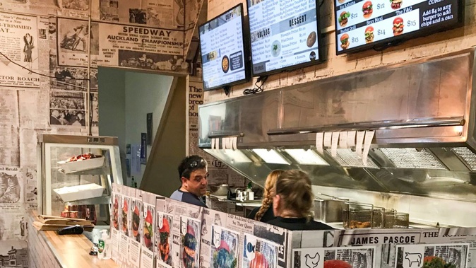 Aaron Drever talking with staff in The Fish and Chippery on Richmond Rd, Grey Lynn in June 2021. (Photo / NZME)