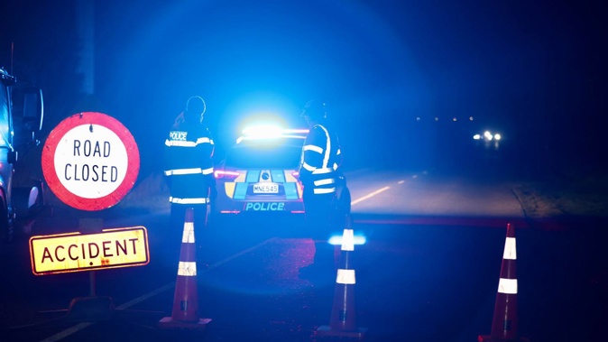 Police in attendance at the crash near Washdyke this evening. (Photo / George Heard)