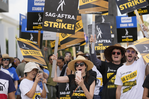 Picketers carry signs on the picket line outside Netflix on Wednesday, Sept. 27, 2023, in Los Angeles. Photo / AP