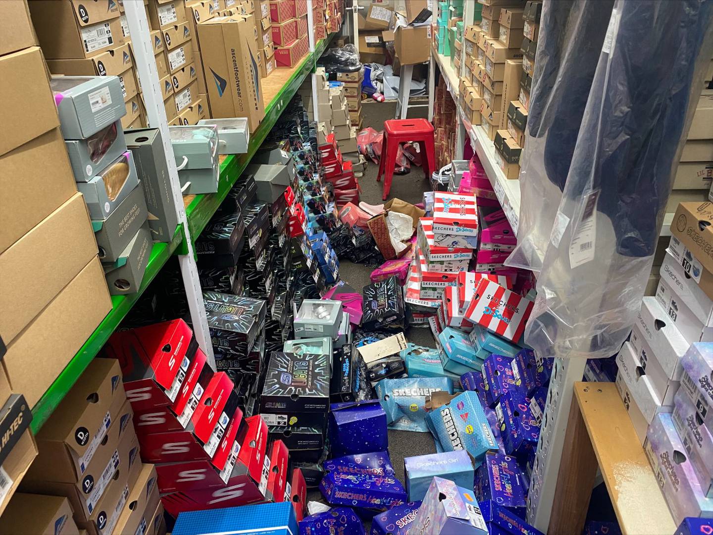 The stockroom at Janbell's uniform shop was flooded, ruining children's school shoes days before the school year begins.