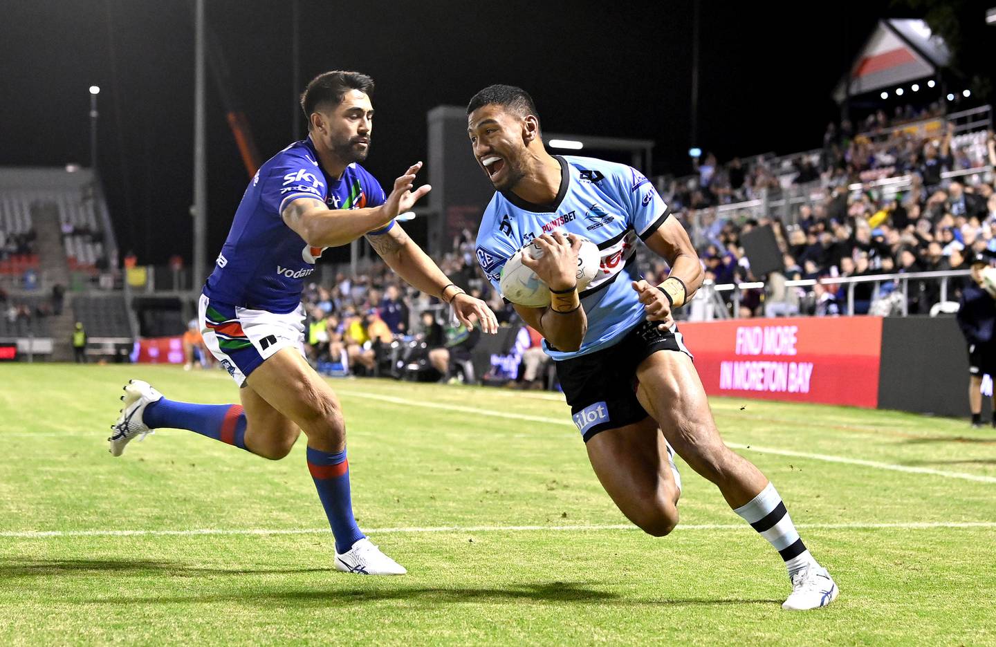 Ronaldo Mulitalo of the Sharks scores a try against the Warriors. Photo / Getty