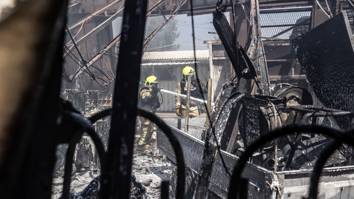 Teams conduct extinguishing work after Lebanese group Hezbollah launches missile attacks on residential areas in Qiryat Shemona, Israel on September 24, 2024. (Photo by Mostafa Alkharouf/Anadolu via Getty Images)
