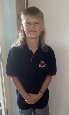 Emmett Lawrence is shaving his mullet to raise funds for childhood friends with cancer. Photo / Kylee Lawrence