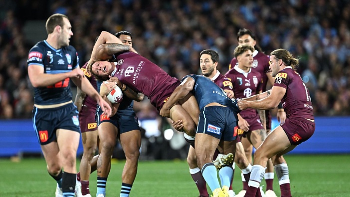 Reuben Cotter of the Maroons is tackled by Tevita Pangai Junior and Payne Haas of the Blues during State of Origin game one. Photo / Photosport
