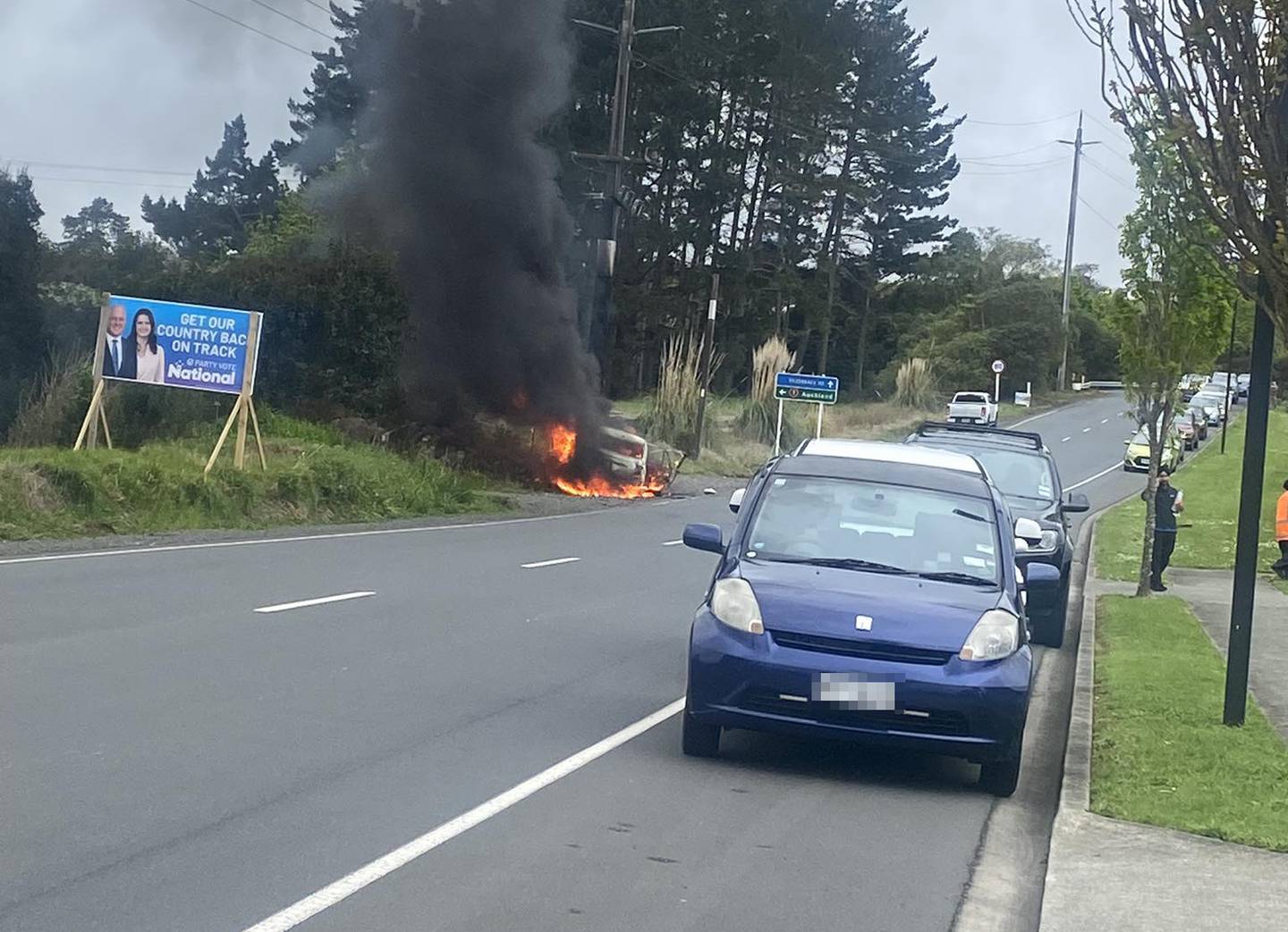 Fire quickly overtook the car after the driver was rescued.