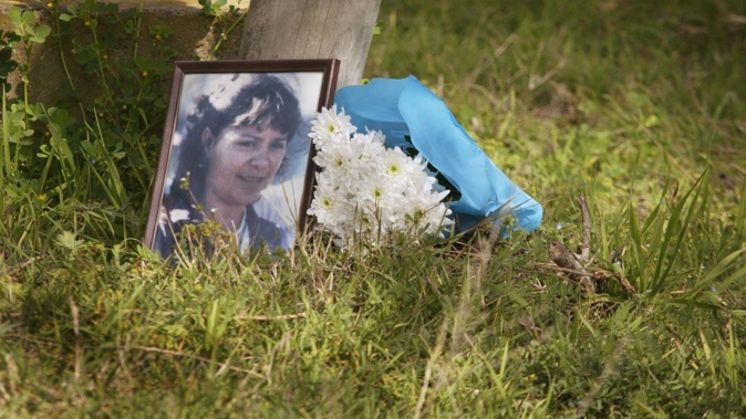 A photo of Colleen Burrows rests at the site where her body was found in 1987, during a tribute in 2005. Photo / NZME