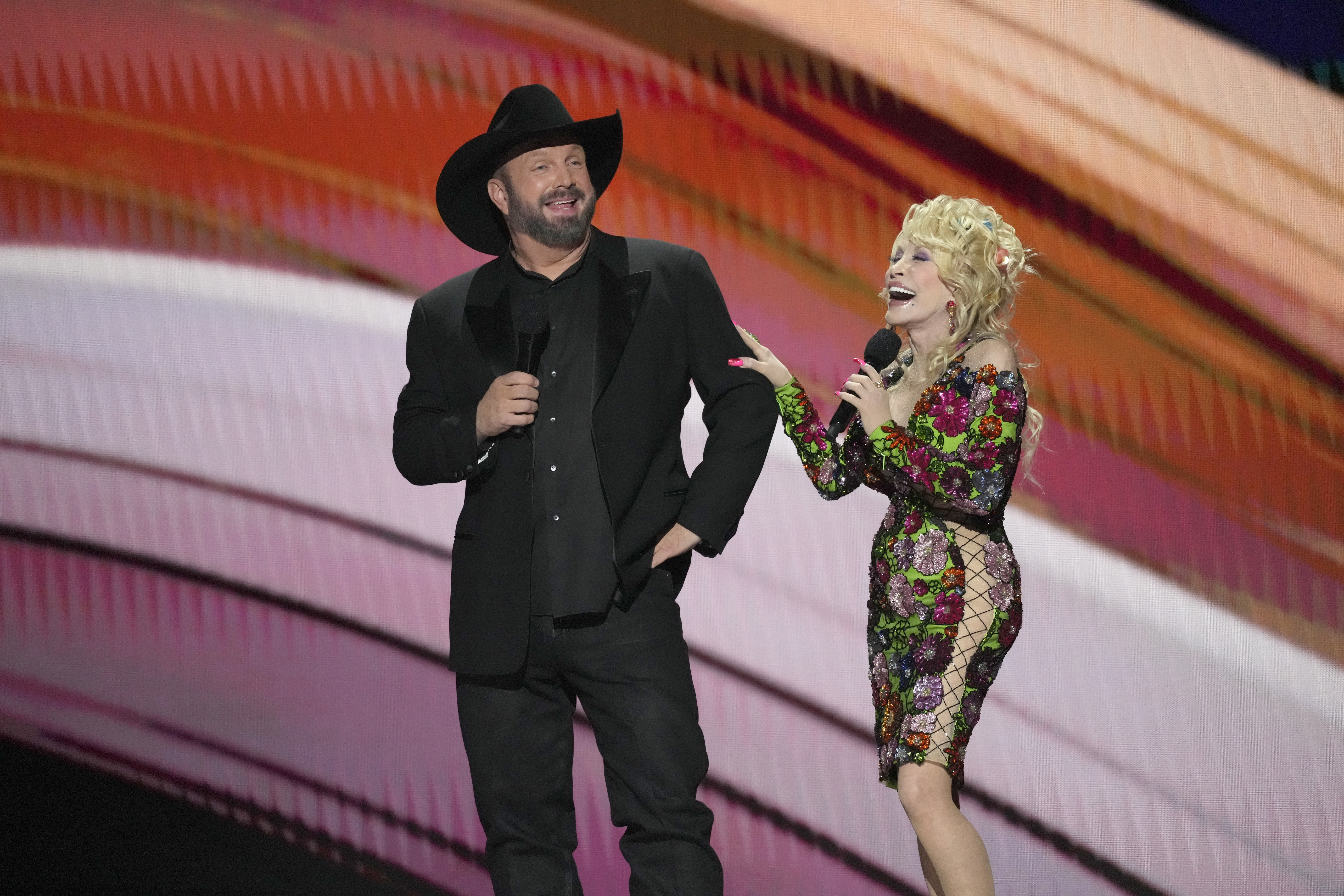 Hosts Garth Brooks, left, and Dolly Parton speak at the 58th annual Academy of Country Music Awards on Thursday, May 11, 2023, at the Ford Center in Frisco, Texas. Photo / AP