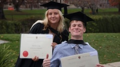 Billionaire Graeme Hart's granddaughter Jemima Hawkesby and her friend Flynn Mitchell graduating. She is fundraising to help find a cure for Mitchell who has Friedreich's Ataxia. Photo / Supplied.