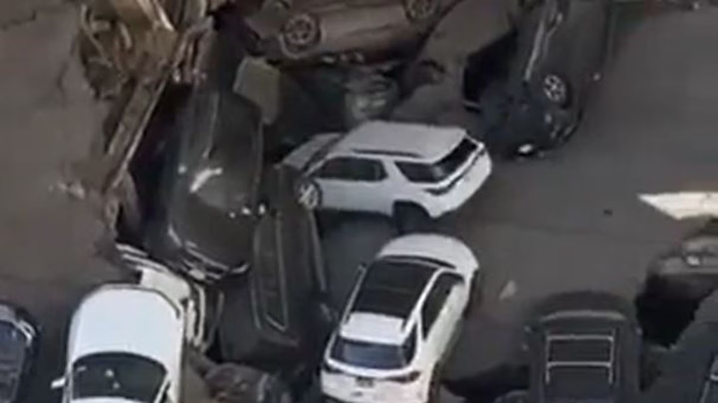 A parking garage in Lower Manhattan has partially collapsed leaving cars destroyed and people trapped. Photo / Pix 11