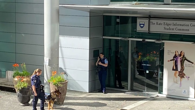Armed police and dog units respond to reports of a man armed with a weapon seen on the University of Auckland campus. Photo / George Block