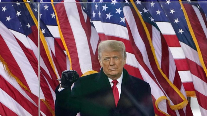 Then-US President Donald Trump gestures as he arrives to speak at a rally in Washington. Photo / AP