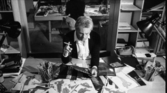 Giorgio Armani examining drawings for new designs. Photo / Getty Images