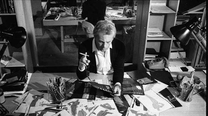 Giorgio Armani examining drawings for new designs. Photo / Getty Images