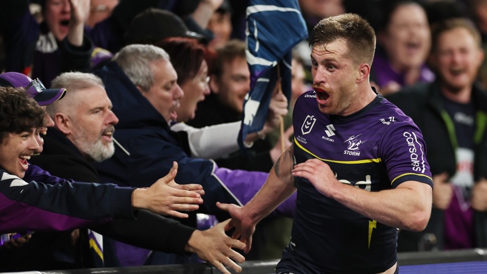 Cameron Munster of the Storm celebrates after scoring a try during the NRL Preliminary Final match between the Melbourne Storm and Sydney Roosters at AAMI Park on September 27, 2024 in Melbourne, Australia. (Photo by Cameron Spencer/Getty Images)
