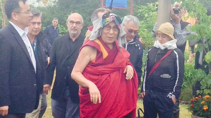 Dalai Lama spoke for an hour at Glastonbury Festival about how the world could be a happier place ( Kaya Burgess / Twitter)