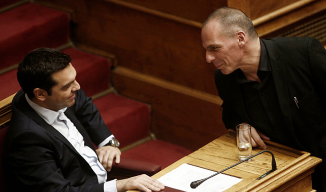 Alexis Tsipras, Greece's prime minister, left, speaks with Yanis Varoufakis, Greece's finance minister, inside the Greek parliament in Athens (Getty Images) 