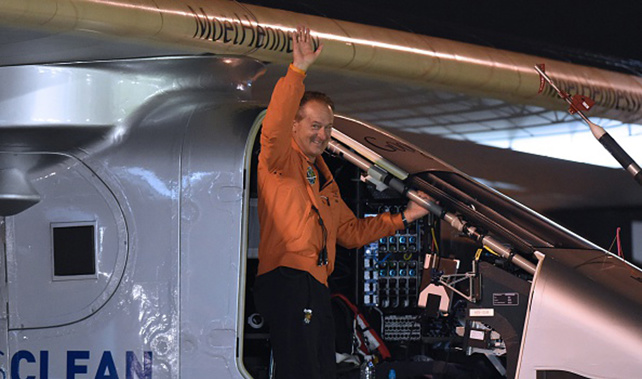 Andre Borschberg of Switzerland waves while boarding his Solar Impulse 2 prior to his departure for Hawaii at the Nagoya airport in Nagoya on June 24, 2015 (Getty Images) 