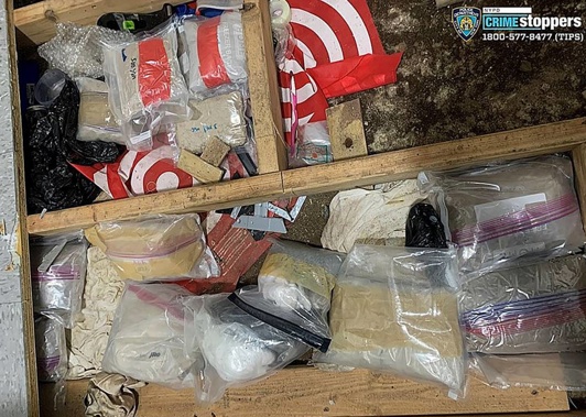 A trap door covers narcotics, including fentanyl, and drug paraphernalia stored in the floor of a daycare centre. 