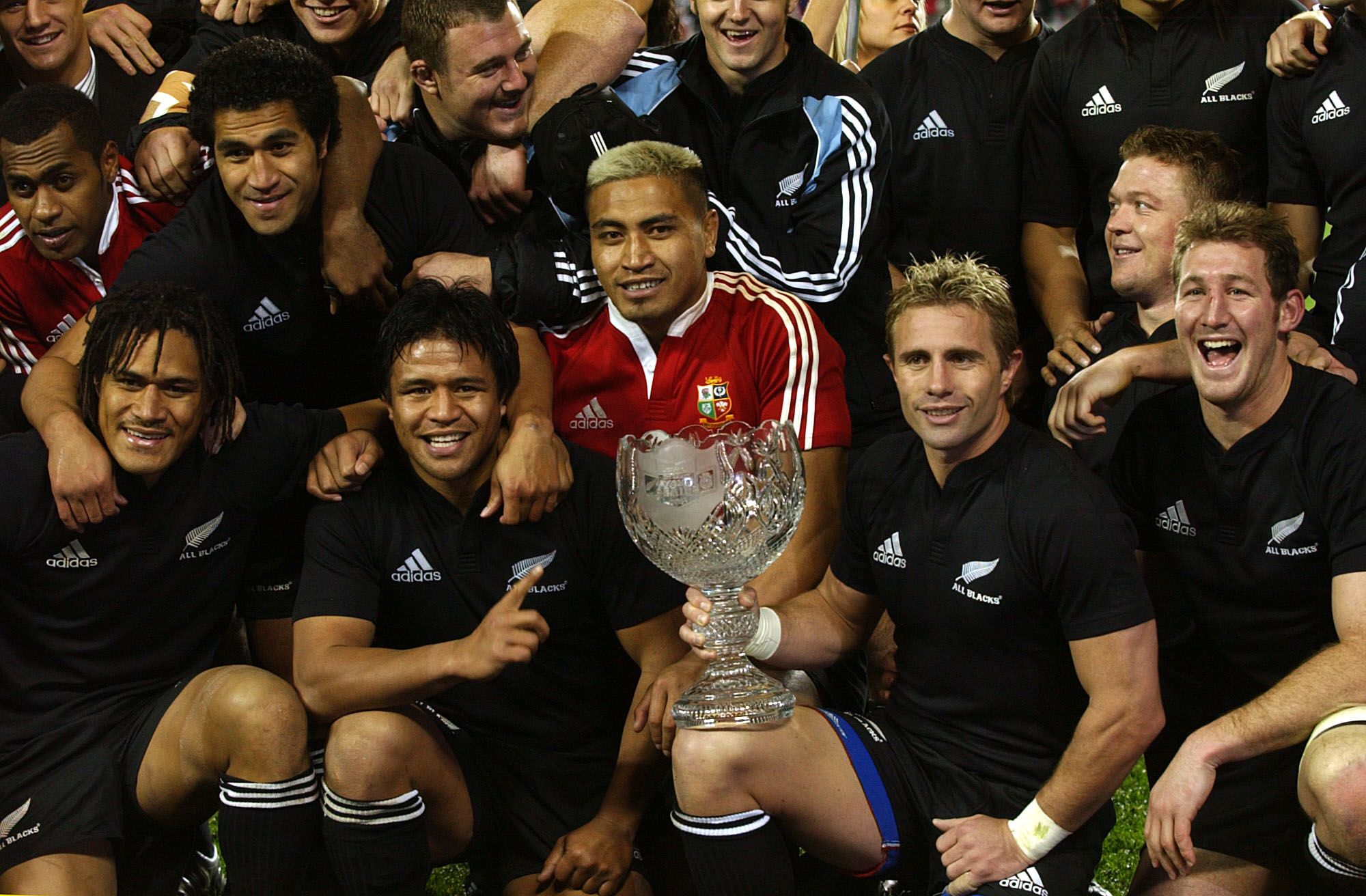 The All Blacks celebrate their third and final win over the Lions.