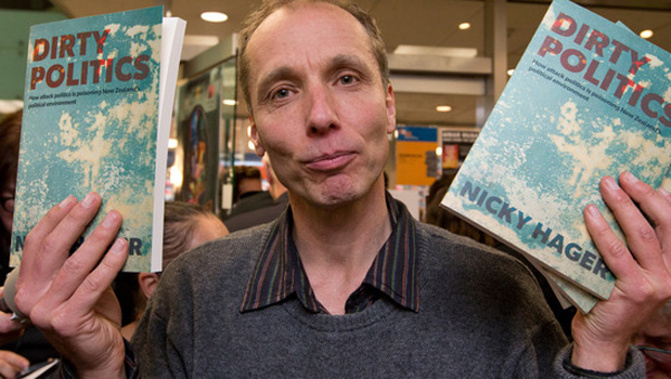 Nicky Hager with copies of his book Dirty Politics (NZ Herald) 