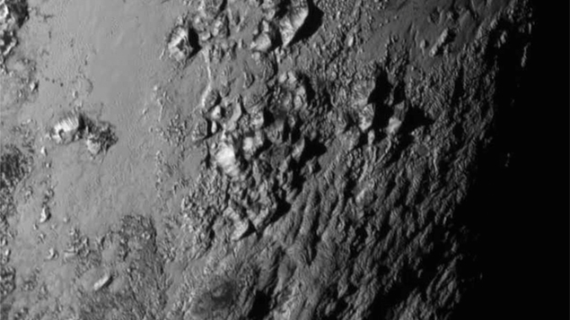 The most recent photo of Pluto, showing the rugged terrain on the rocky surface. 