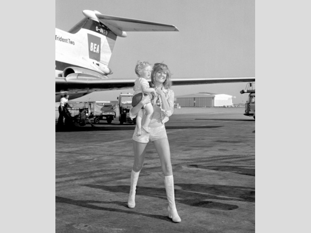 Cilla with her son Robert at Heathrow Airport while flying back from Nice.