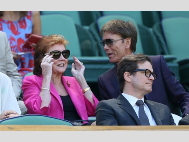 With Sir Cliff Richard and Colin Firth in the Royal Box at the Wimbledon Championships last year.